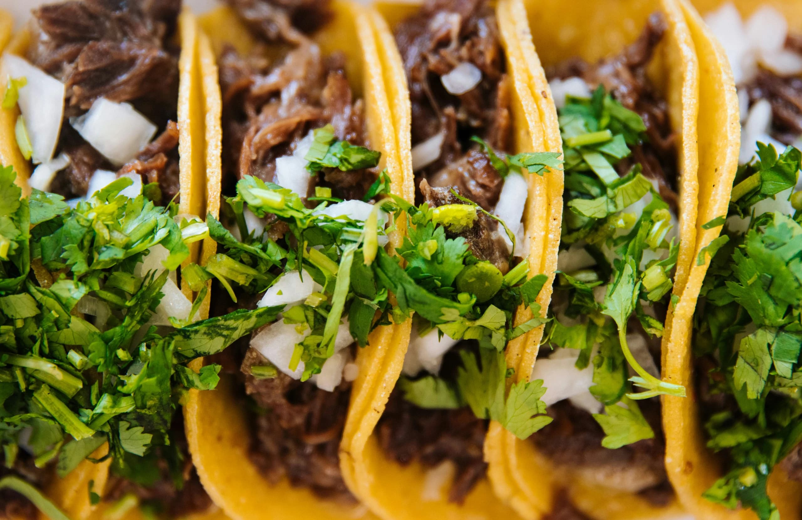 The approved Super Tacos homepage hero photograph of freshly prepared tacos
